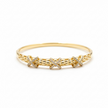 Bracelet Jonc Doré aux Détails Croisés et Zircons Étincelants