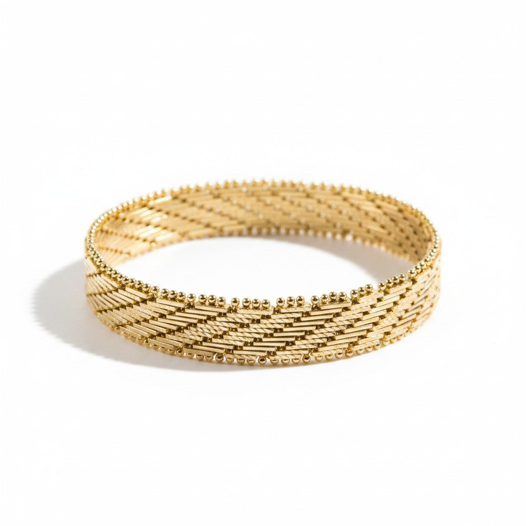 ANIBA JEWELS gold braided bracelet with a sophisticated, luminous design. Elegant and timeless.