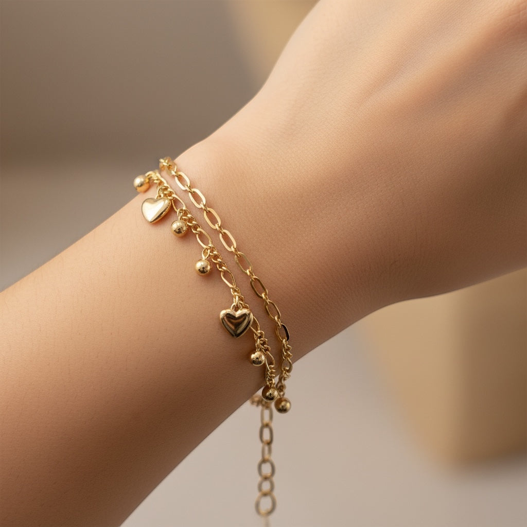 ANIBA JEWELS rose gold double chain bracelet with small dangling hearts and beads. Adjustable.